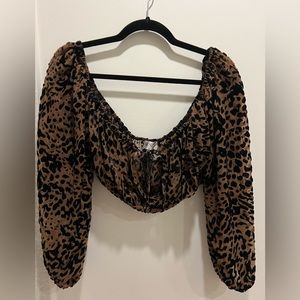 House of CB animal print sheer strapless blouse.